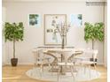 Light filled dining room featuring hardwood floors, white walls, modern chandelier and table at 6448 Fairfax Ct, Maiden, NC 28650