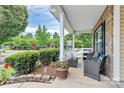 Relaxing front porch with comfortable seating and views of the landscaped yard at 902 Silverberry St, Gastonia, NC 28054