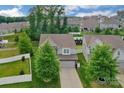 Aerial view of a home in a peaceful neighborhood surrounded by trees and well-kept lawns at 236 Robinwood Ln, Clover, SC 29710