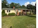 Lovely single-story brick home with an inviting covered porch and well-maintained yard at 3085 Faith Rd, Salisbury, NC 28146