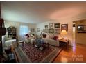 Inviting living room with lots of natural light, stylish decor, and hardwood floors at 506 Hearne Farm Rd, Mount Gilead, NC 27306
