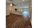 The bright living room features a ceiling fan and an open layout that flows into the kitchen and dining areas at 268 Hatley Ne Cir, Concord, NC 28025