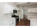 Modern kitchen featuring stainless steel appliances, white cabinetry, and bright countertops at 3422 Balsam Tree Dr, Charlotte, NC 28269