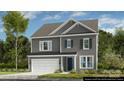 Charming gray two-story home featuring a two-car garage, dark shutters, and a well-manicured front yard at 4010 Caymen Bay Ct, Tega Cay, SC 29708