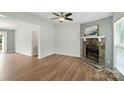Spacious living room with hardwood floors, ceiling fan, and natural light at 8106 Strawberry Point Dr, Charlotte, NC 28215