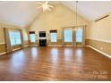 Spacious living room boasting a high ceiling, fireplace, and several windows providing natural light at 105 Whimbrel Ln, Mooresville, NC 28117