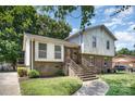 Charming two-story home with brick facade and a well-maintained front lawn at 421 Vickery Dr, Charlotte, NC 28215