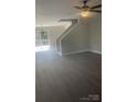 Bright living room featuring new floors, modern ceiling fan, and sliding glass door leading to outdoor balcony at 961 Poplar Forest Rdg, Clover, SC 29710