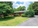 Well-maintained brick home with lush landscaping and a welcoming front lawn at 1008 2Nd Se St, Conover, NC 28613