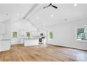 Spacious kitchen with white cabinets, a center island, stainless appliances, and natural light at 7 S Coulter Ave, Newton, NC 28658