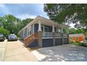 Beautifully renovated home with a welcoming front porch and ample parking at 502 Allison Nw St, Concord, NC 28025