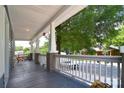 View of a spacious front porch with white railings and wood flooring at 502 Allison Nw St, Concord, NC 28025