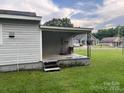 Covered back porch offering a serene outdoor space with backyard access at 104 Franklin St, Clover, SC 29710