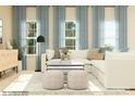 Cozy living room featuring a white sectional, soft blue curtains and ample natural light at 1606 Swallow Tail Dr, Cramerton, NC 28012