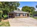 All brick single-story home with a spacious driveway, black shutters, and covered porch at 508 Gantt St # 1-2, Kings Mountain, NC 28086