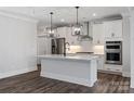 Elegant kitchen with white cabinetry, stainless steel appliances, and marble countertops at 1312 Copper Leaf Dr, Rock Hill, SC 29732