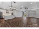 Bright and airy living space featuring dark wood floors and a seamless connection to the kitchen at 1312 Copper Leaf Dr, Rock Hill, SC 29732