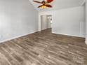Spacious living room featuring a vaulted ceiling and tile flooring, ready for your personal touches and decor at 1634 Dawson Ct, Rock Hill, SC 29730
