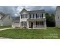 Charming two-story home with black shutters and a well-maintained lawn at 2113 Ballingarry Dr, Statesville, NC 28625