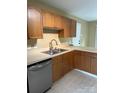 Functional kitchen featuring wood cabinets, stainless steel appliances, and ample counter space at 2113 Ballingarry Dr, Statesville, NC 28625