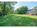 Expansive backyard featuring a well-kept lawn and an inviting deck area at 630 4Th Nw Ave, Hickory, NC 28601