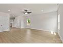 Spacious living area with natural light, neutral paint, and hardwood flooring at 7007 Jerimoth Dr, Charlotte, NC 28215