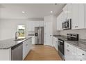 Modern kitchen with granite countertops, stainless steel appliances, and ample cabinet space at 7023 Jerimoth Dr, Charlotte, NC 28215