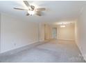 Open living room with neutral carpet, a ceiling fan, and ample natural light at 238 Pointe Cir, Rock Hill, SC 29732