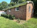 Brick house with manicured bushes and bright trimmed windows at 28 Maiden Ln, York, SC 29745