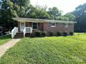 Traditional brick home with a well-kept lawn and mature trees at 28 Maiden Ln, York, SC 29745