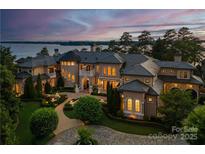 Luxury waterfront home with expansive grounds and a private pool at 18019 Harbor Light Blvd, Cornelius, NC 28031