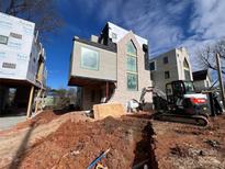 Modern home with light brick exterior and unique architectural details at 719 Charles Ave, Charlotte, NC 28205