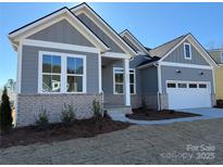 Gray and white two-story house with a two-car garage at 5217 Glenwalk Dr # 0059, Charlotte, NC 28269