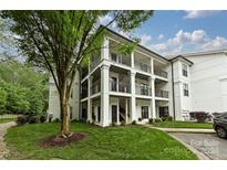 Two-story condo building with white exterior and balconies at 17810 Half Moon Ln # Q, Cornelius, NC 28031