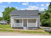 Charming gray house with a white porch and well-manicured lawn at 37 Knox St, Salisbury, NC 28144