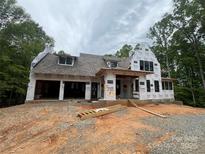 Exterior view of a house under construction with dark window frames and gray roof at 1052 Ventosa Dr, Denver, NC 28037