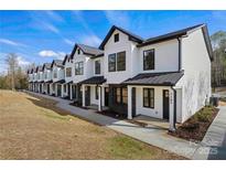 Modern townhome community with white exteriors and black accents at 204 Kimball Rd, China Grove, NC 28023