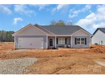 New construction home featuring a two-car garage, craftsman style architecture, and professional landscaping at 6122 Lowder Rd, Salisbury, NC 28147