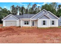 Charming single-story home with blue and white siding, gray shutters, and an attached garage at 6147 Long Branch Rd, Salisbury, NC 28147