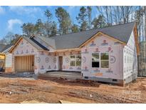 New construction home featuring an attached garage, and windows on a building site at 6155 Long Branch Rd, Salisbury, NC 28147
