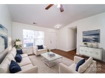 Bright living room with hardwood floors and neutral decor at 2327 Hope Valley Ln, Charlotte, NC 28213