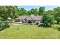 Stunning ranch home with covered porch and landscaped yard at 11732 Kennewick Rd, Charlotte, NC 28216