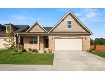 Charming single-story home with a brick and vinyl facade and a two-car garage at 833 B Wynnshire Dr # 55, Hickory, NC 28601
