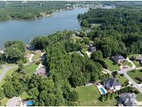 Aerial view showcasing waterfront homes nestled along the tree-lined shores of Lake Norman at 127 Palos Verde Rd, Mooresville, NC 28117