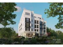 Luxury building exterior, showcasing elegant design and landscaping at 409 Queens Rd # 204, Charlotte, NC 28207