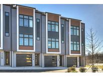 Modern three-story townhouses with attached garages at 112 Frazier Ave, Charlotte, NC 28216