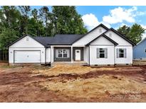 Charming single-story home with white siding, a gray roof, and an attached garage at 6169 Long Branch Rd, Salisbury, NC 28147