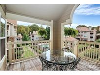 Private balcony with table and chairs, overlooks the community at 5003 Sharon Rd # L, Charlotte, NC 28210