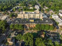 Aerial view of a modern apartment building in a vibrant urban setting at 1320 Fillmore Ave # 311, Charlotte, NC 28203