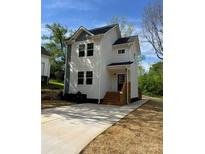 Charming two-story home with a well-manicured lawn and inviting entrance at 1137 6Th St, Lancaster, SC 29720